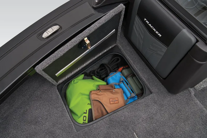 Slide: The Image of 2026 Tracker Targa V-18 WT boat interior with storage compartment and seating. - 22