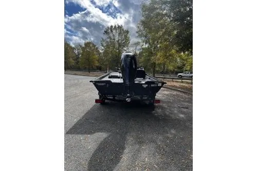 Slide: The Image of 2026 Tracker Pro Team 175 Crappie Edition boat, rear view, parked outdoors. - 3