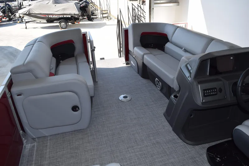 Slide: The Image of 2026 Sun Tracker Party Barge 22 RF DLX interior with spacious seating and modern console. - 10