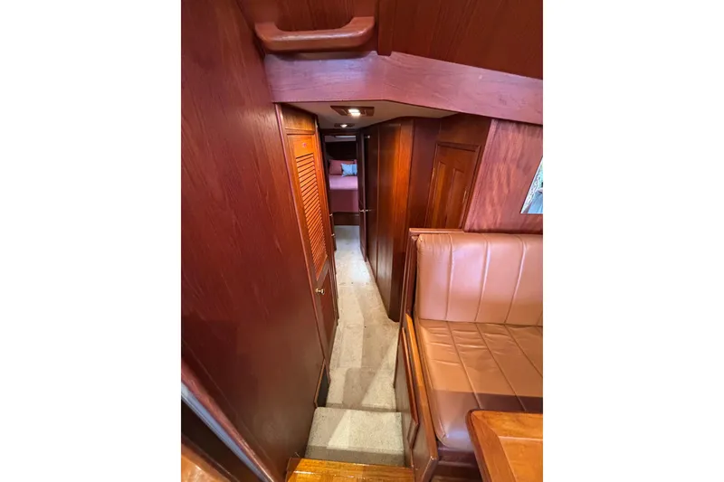 Slide: The Image of Interior of 1986 Viking 48 Convertible yacht with wood paneling and seating. - 30