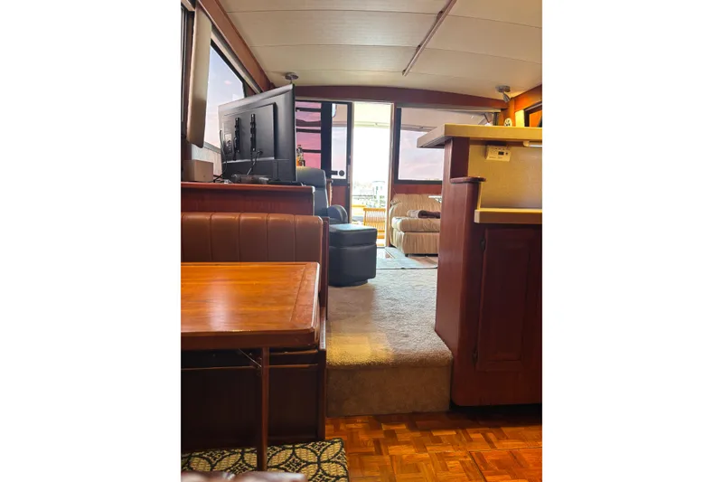 Slide: The Image of Interior of 1986 Viking 48 Convertible yacht with cozy seating and modern amenities. - 34