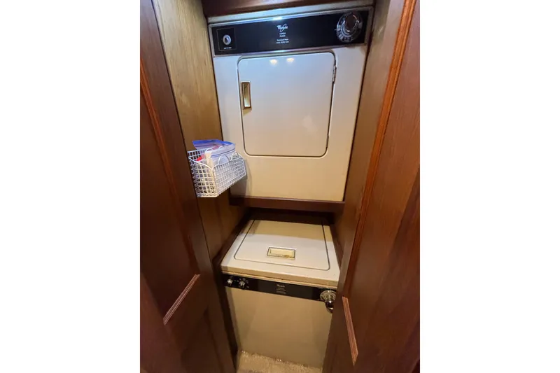 Slide: The Image of Laundry area in 1986 Viking 48 Convertible yacht with stacked washer and dryer. - 36