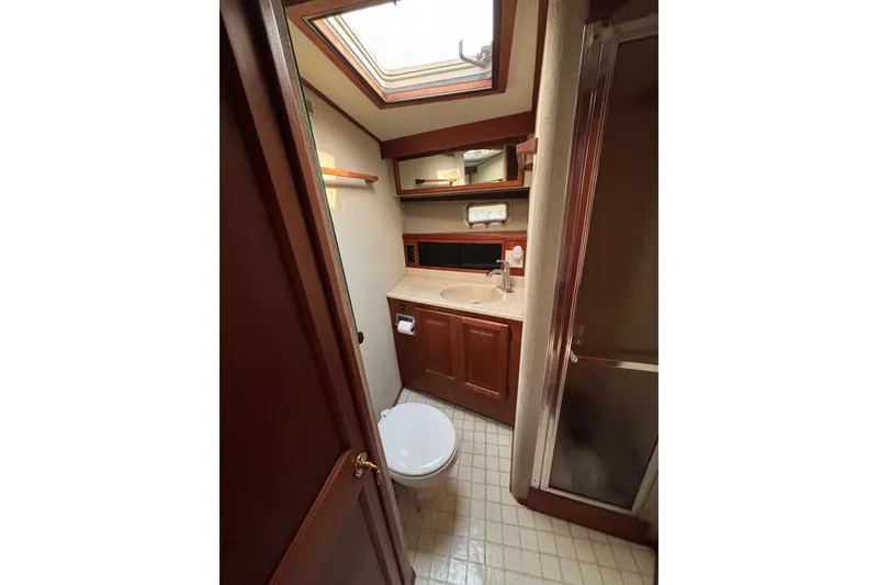 Slide: The Image of Bathroom interior of 1986 Viking 48 Convertible yacht with skylight and shower. - 41