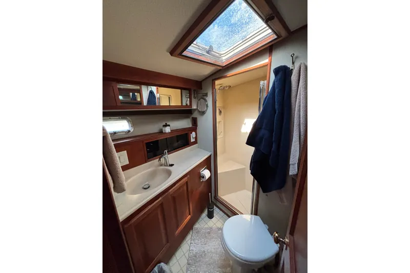 Slide: The Image of Bathroom interior of 1986 Viking 48 Convertible yacht with skylight and shower. - 48