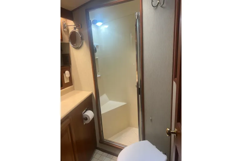 Slide: The Image of Bathroom interior of 1986 Viking 48 Convertible yacht with shower and vanity. - 49