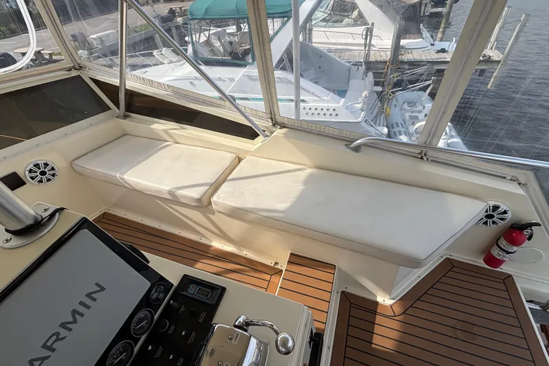 Slide: The Image of Interior view of 1986 Viking 48 Convertible yacht with seating and navigation equipment. - 54