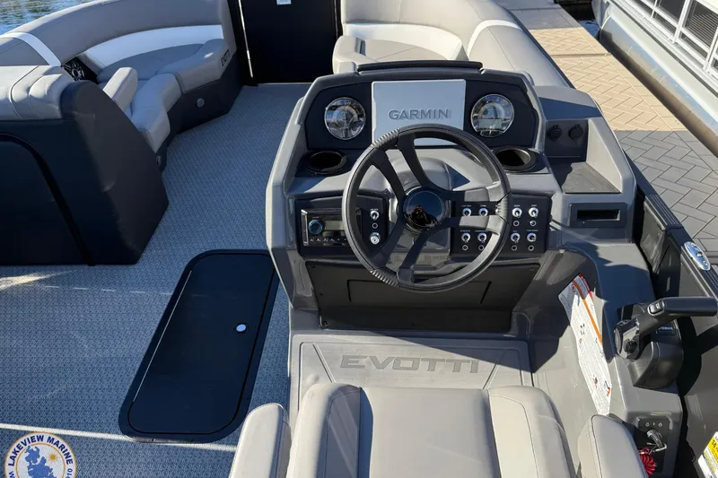 Slide: The Image of Interior of 2026 Evotti 523CS boat with Garmin navigation system and modern steering console. - 10