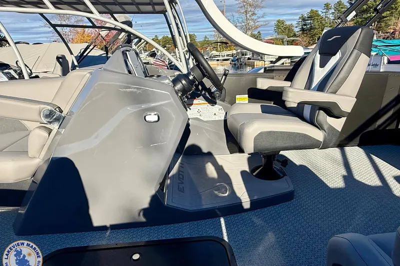 Slide: The Image of Interior of 2026 Evotti 523CS boat with modern steering and seating. - 12