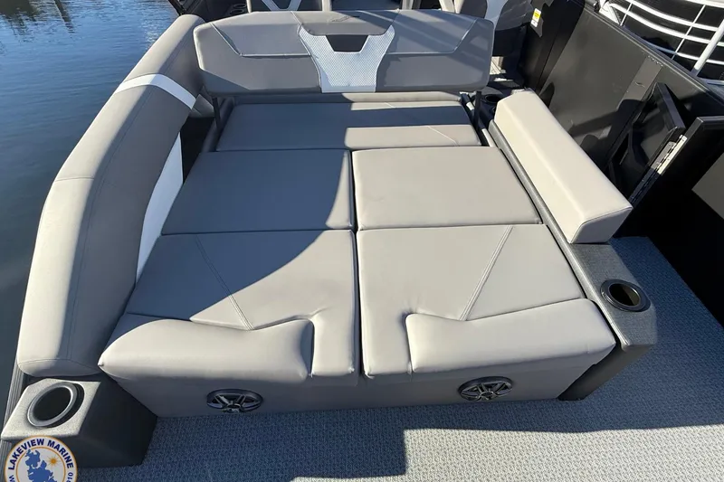 Slide: The Image of Luxurious seating on 2026 Evotti 523CS boat with gray upholstery and cup holders. - 16