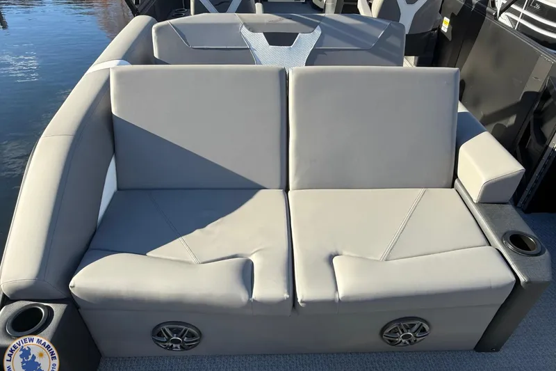 Slide: The Image of Luxurious seating on 2026 Evotti 523CS boat with cup holders and speakers. - 17