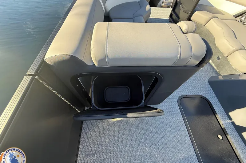 Slide: The Image of 2026 Evotti 523CS boat interior with open storage compartment and cushioned seating. - 8