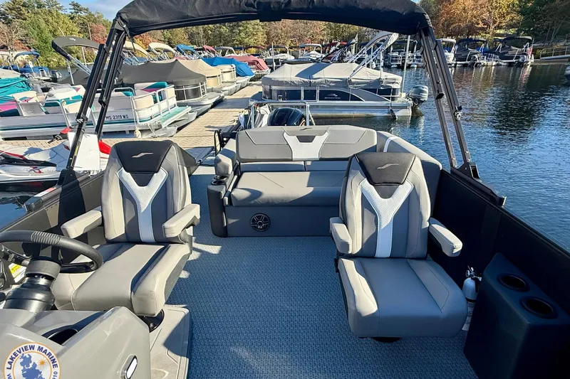 Slide: The Image of 2026 Evotti 523CS boat interior with modern seating at a marina. - 9