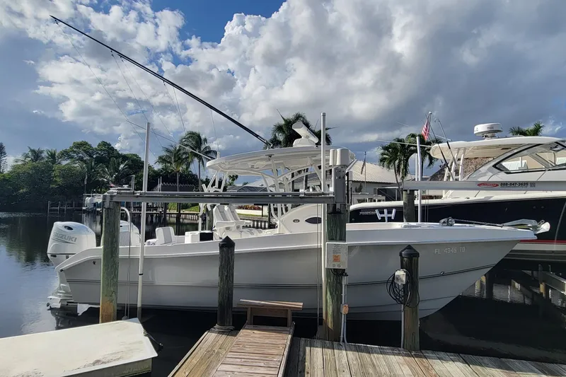 Slide: The Image of 2022 Twin Vee 260 CC SE Classic boat docked at marina under cloudy sky. - 14