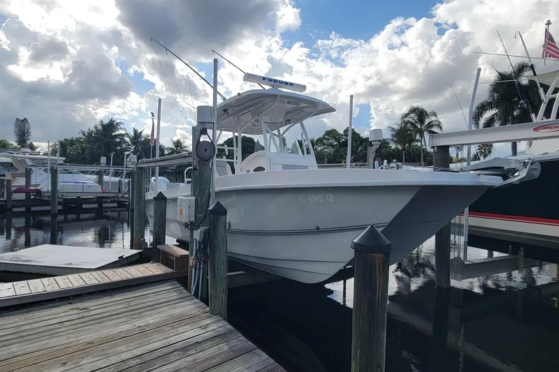 Slide: The Image of 2022 Twin Vee 260 CC SE Classic boat docked at marina under cloudy sky. - 6