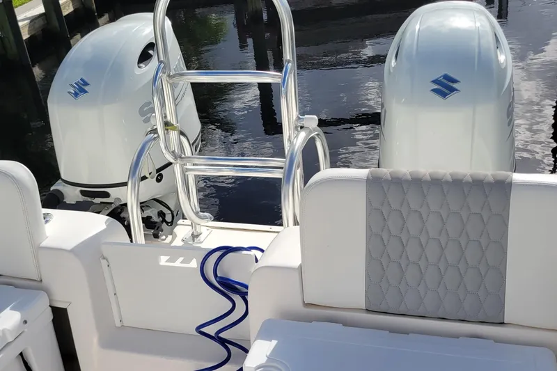 Slide: The Image of 2022 Twin Vee 260 CC SE Classic boat with dual Suzuki outboard engines. - 7