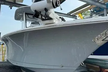 Slide: The Image of 2018 Sea Hunt Gamefish 27 boat in storage, side view. - 3