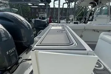 Slide: The Image of 2018 Sea Hunt Gamefish 27 boat with dual 150 engines, docked at marina. - 4