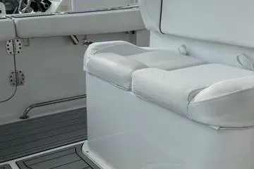Slide: The Image of 2018 Sea Hunt Gamefish 27 boat interior with cushioned seating and sleek design. - 6