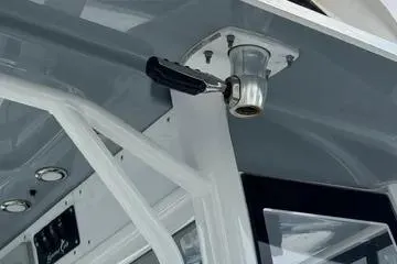 Slide: The Image of 2018 Sea Hunt Gamefish 27 boat interior detail with rod holder and canopy. - 8