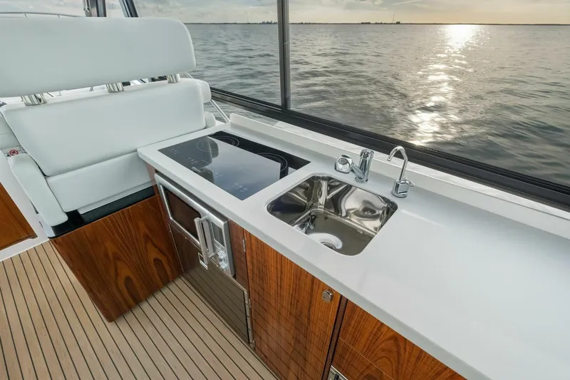 Slide: The Image of Aerial view of 2025 MJM 42 yacht on green water. - 38