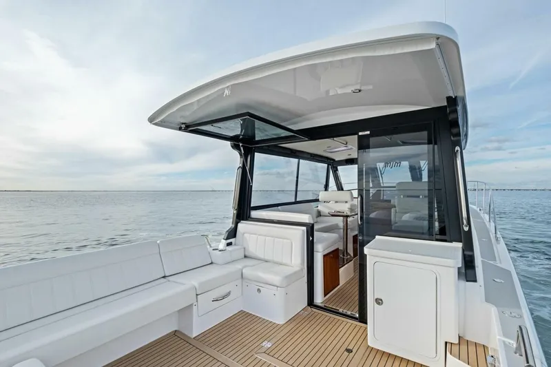 Slide: The Image of Aerial view of 2025 MJM 42 yacht cruising on green water. - 45