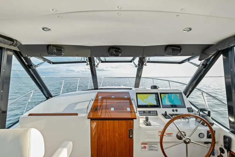 Slide: The Image of Luxurious interior of 2025 MJM 42 yacht with ocean view and elegant seating. - 8