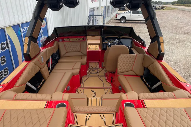 Slide: The Image of 2026 Tigé Z3 boat interior with luxurious tan seating and red accents. - 5