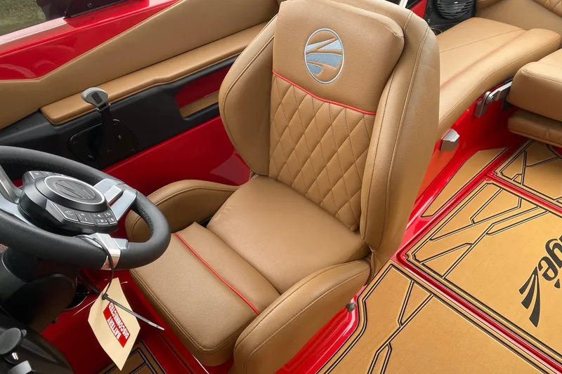 Slide: The Image of 2026 Tigé Z3 boat interior with tan leather seat and red accents. - 7