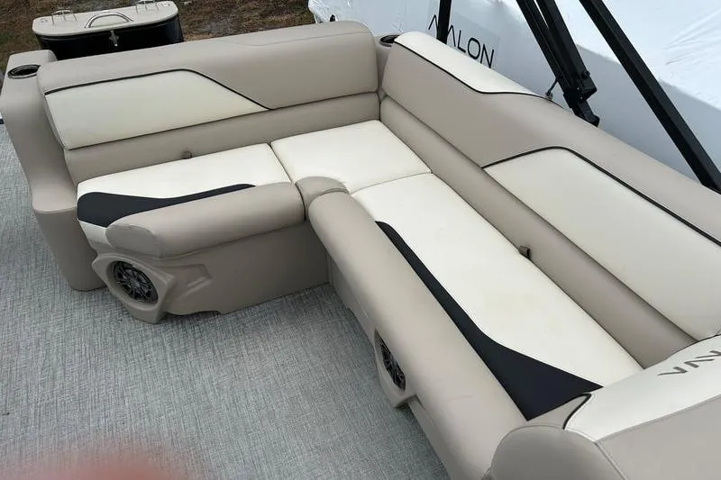 Slide: The Image of 2026 Avalon Venture Rear Bench with beige and black upholstery on a boat deck. - 5