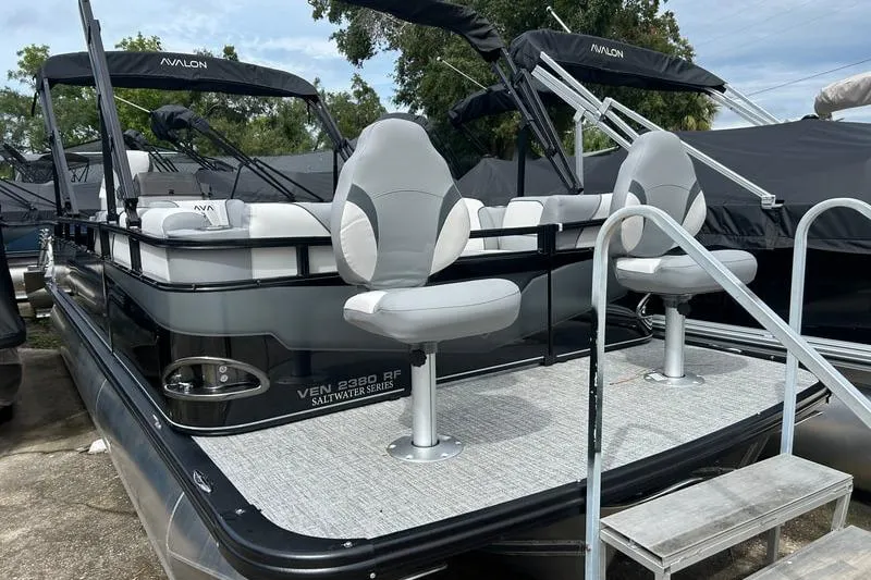 The Image of 2026 Avalon Venture Fish N Cruise pontoon boat with seating and canopy. - 1
