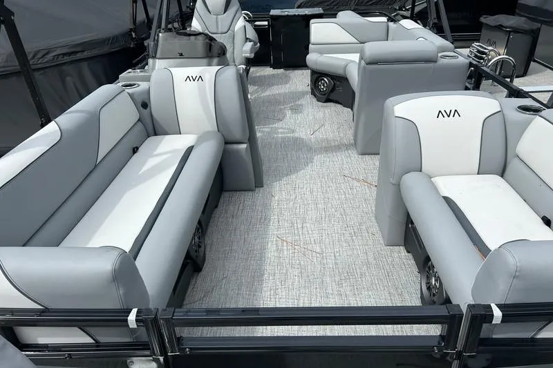 Slide: The Image of 2026 Avalon Venture Fish N Cruise boat interior with gray and white seating. - 3