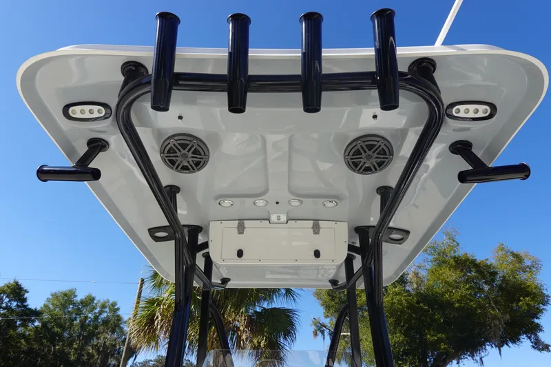 Slide: The Image of 2026 Sea Hunt BX 22 BR boat interior with cushioned seating and steering wheel. - 16