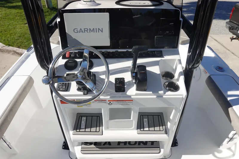 Slide: The Image of 2026 Sea Hunt BX 22 BR boat console with Garmin navigation and steering wheel. - 19