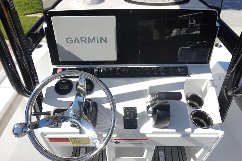 Slide: The Image of 2026 Sea Hunt BX 22 BR boat console with storage compartment and chrome fixtures. - 20