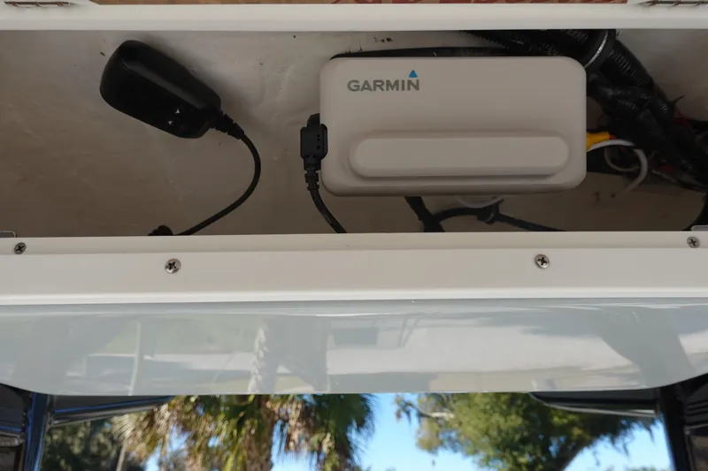 Slide: The Image of 2026 Sea Hunt BX 22 BR boat dashboard with compass and logo detail. - 22