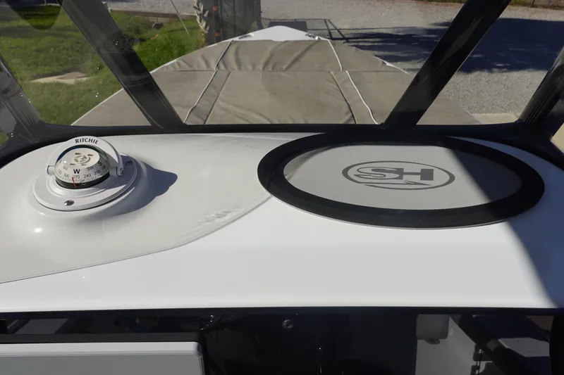 Slide: The Image of 2026 Sea Hunt BX 22 BR boat interior with cushioned seating and sleek design. - 23