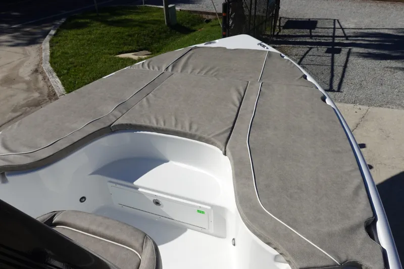Slide: The Image of 2026 Sea Hunt BX 22 BR boat with cushioned deck, gray upholstery. - 26