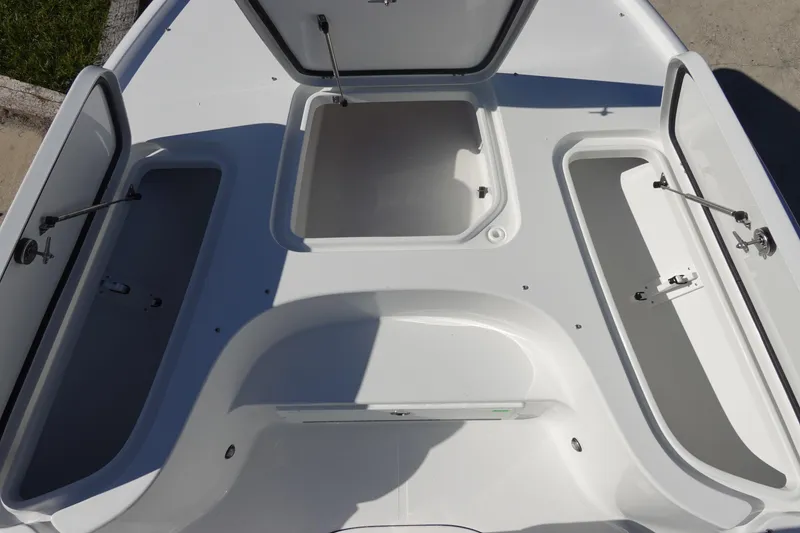 Slide: The Image of 2026 Sea Hunt BX 22 BR boat storage compartment, open and empty. - 29