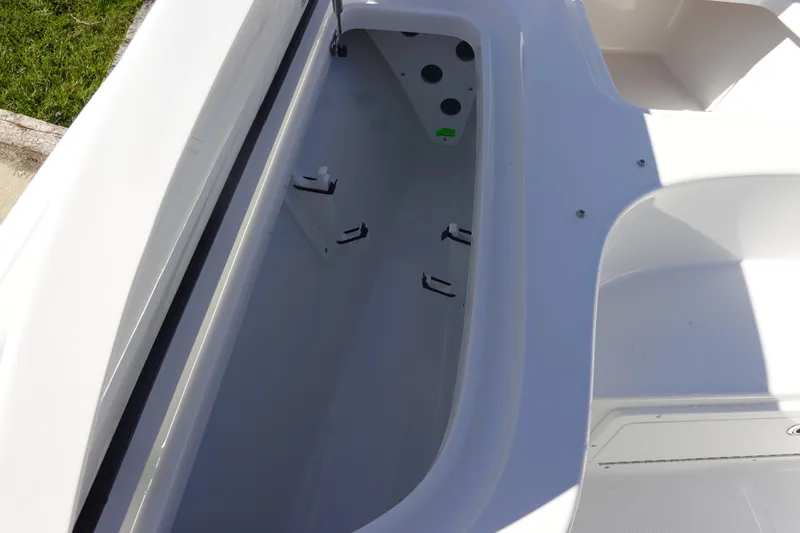 Slide: The Image of 2026 Sea Hunt BX 22 BR boat storage compartment, open and empty, with white interior. - 30