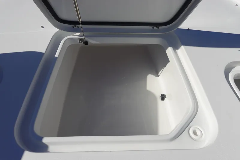 Slide: The Image of 2026 Sea Hunt BX 22 BR boat storage compartment, open and empty. - 32