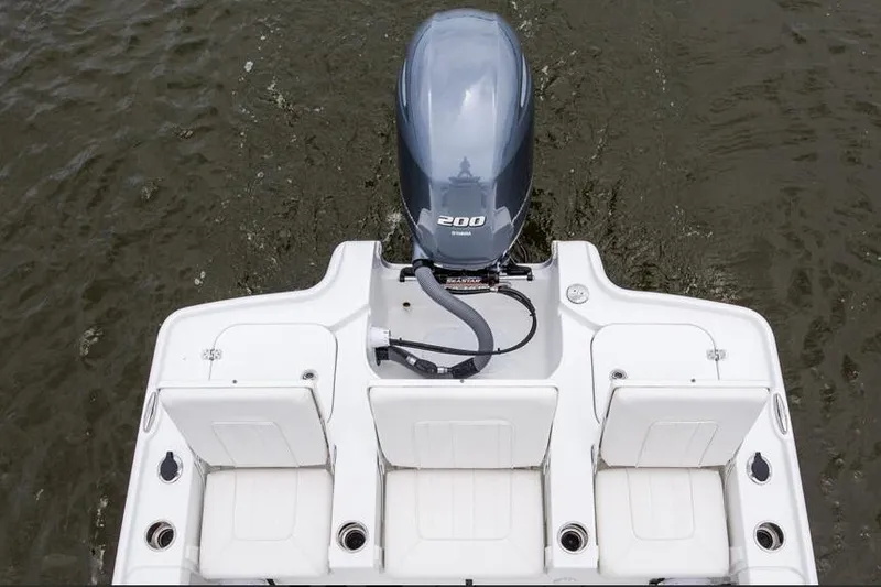 Slide: The Image of 2026 Sea Hunt BX 22 BR boat deck with storage compartments and motor. - 7
