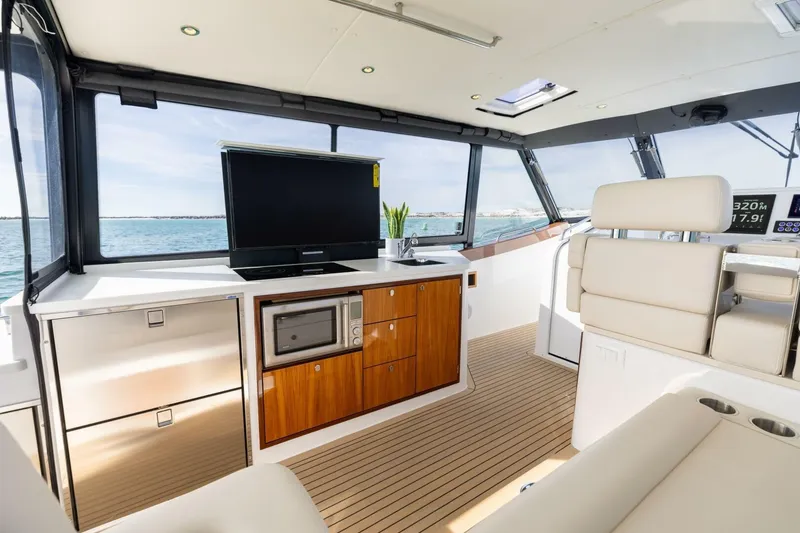 Slide: The Image of Luxurious interior of 2025 MJM 4 yacht with modern kitchen and ocean view. - 11