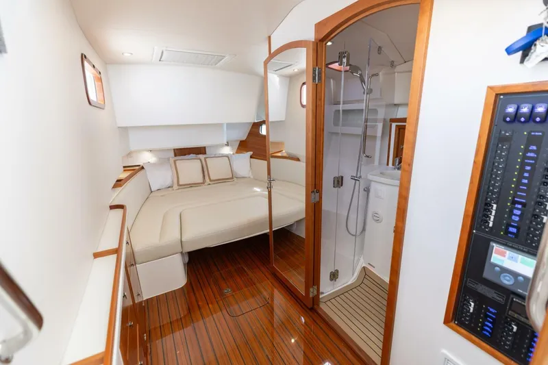 Slide: The Image of Luxurious interior of 2025 MJM 4 yacht with elegant seating and kitchenette. - 13