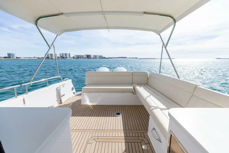 Slide: The Image of Luxurious 2025 MJM 4 yacht deck with seating, overlooking serene ocean waters. - 28