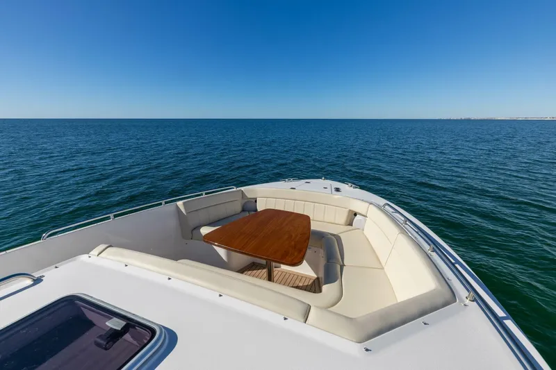 Slide: The Image of Luxurious seating on 2025 MJM 4 boat, overlooking serene ocean waters. - 32