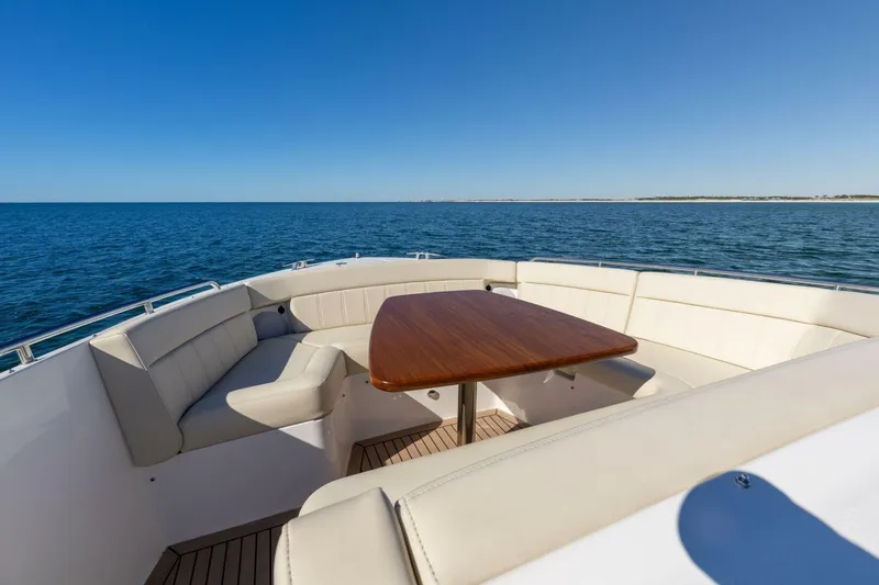 Slide: The Image of Luxury MJM 4 yacht bow with seating and table, 2025 model, on open sea. - 33
