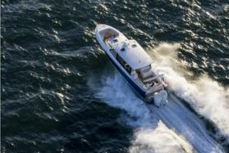 Slide: The Image of Luxurious seating on 2025 MJM 4 boat, overlooking serene ocean waters. - 5