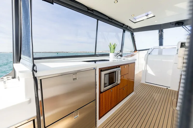 Slide: The Image of Luxurious interior of 2025 MJM 4 yacht with plush seating and ocean view. - 8