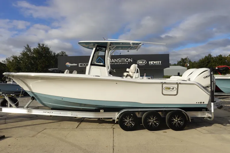 The Image of 2026 Sea Hunt Ultra 275 SE boat on trailer, displayed outdoors. - 0