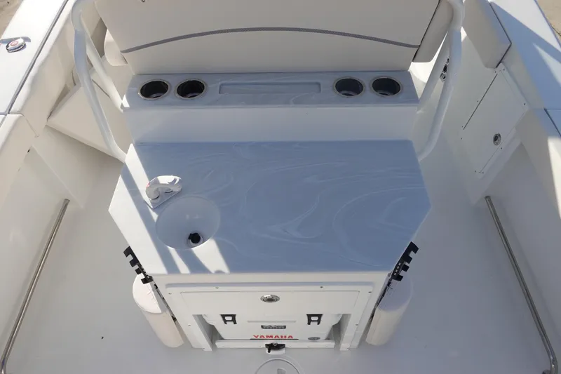 Slide: The Image of Interior of 2026 Sea Hunt Ultra 275 SE boat with cup holders and storage. - 11